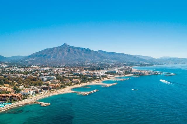 Aerial view of the Costa del Sol coastline with white Mediterranean buildings